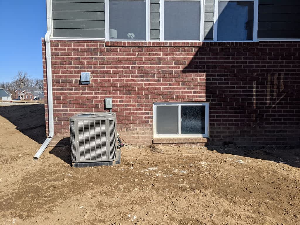 AC Unit and Vent On New Home