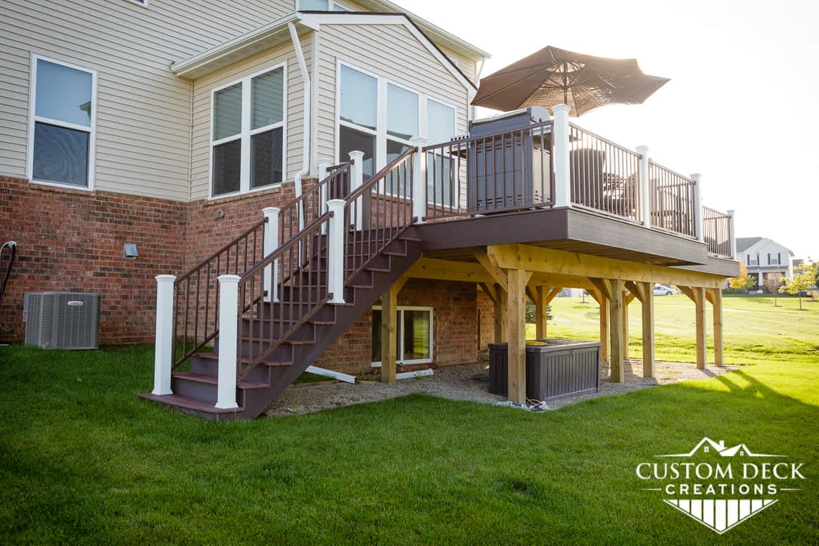 Backyard view of a new construction home with a composite Trex deck built in New Hudson Michigan