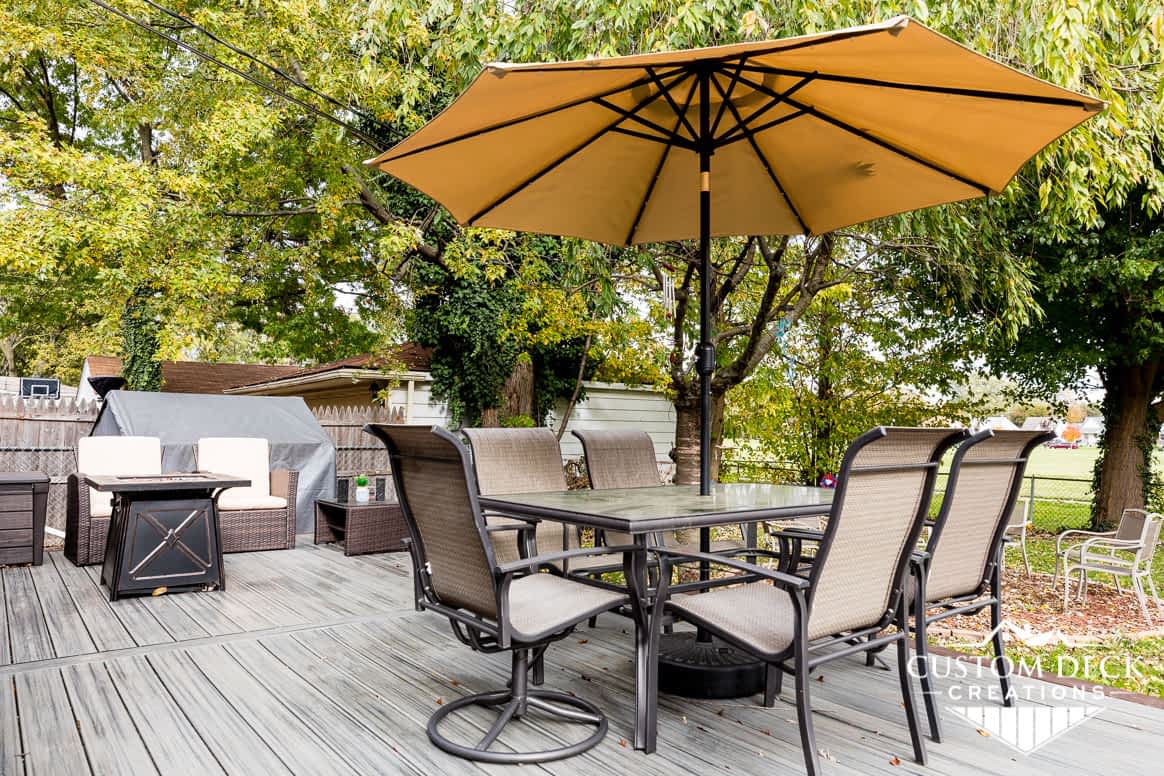 Create shade on an outdoor deck with an umbrella