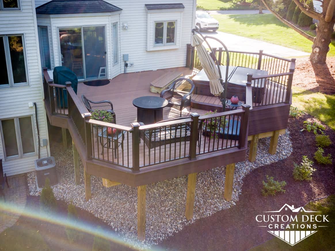 2nd story backyard deck with beeautiful landscaping rocks and mulch around it