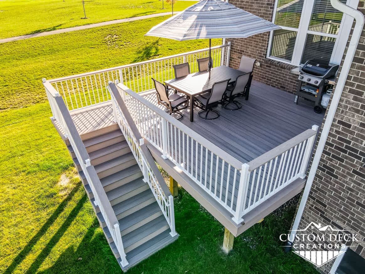 Grey deck with white railing