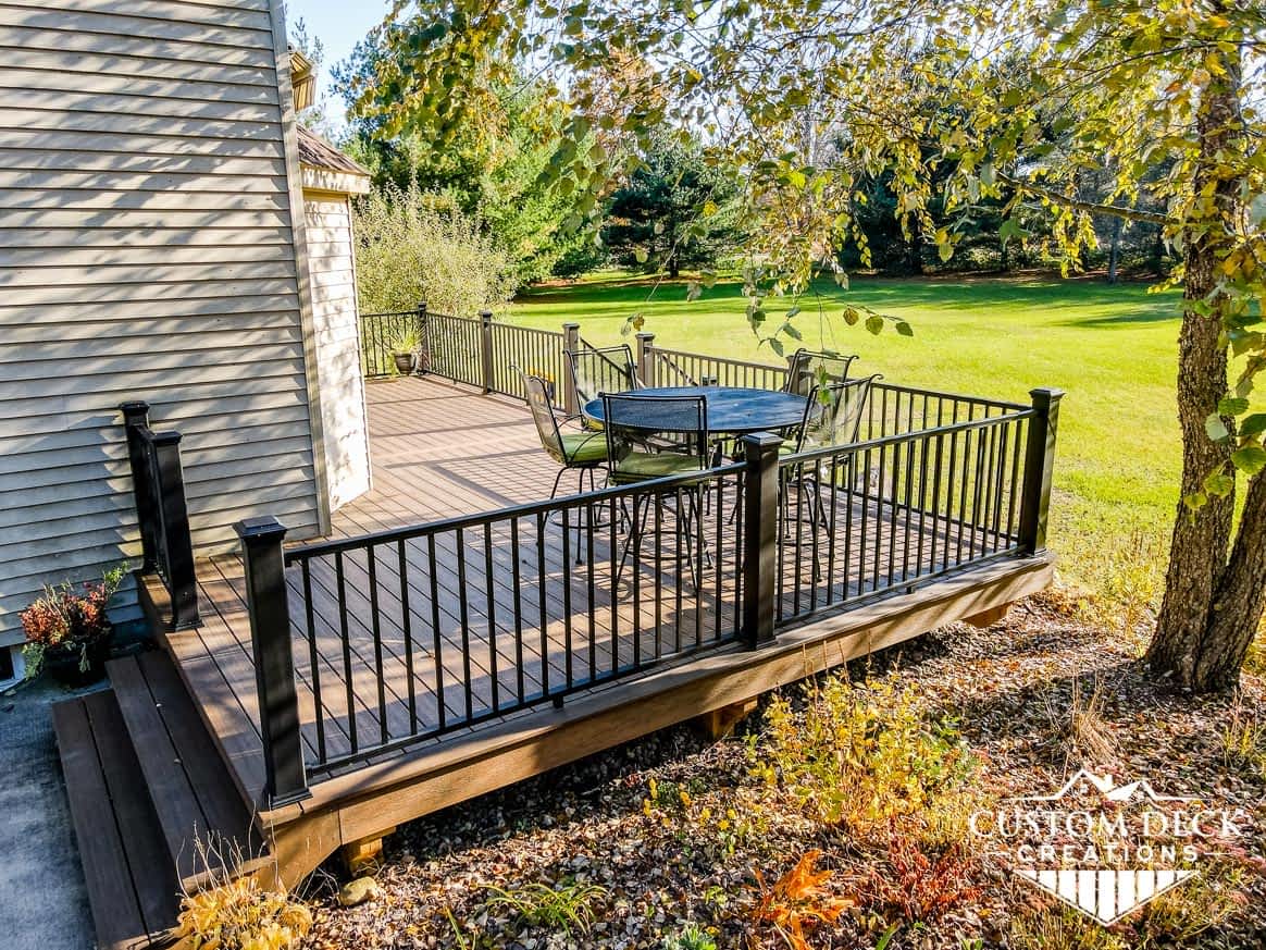 New Trex deck with black railing in Michigan backyard
