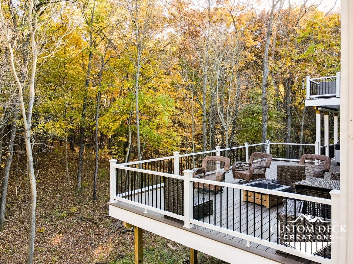 Large multi-tier deck with woods view