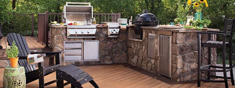 Outdoor kitchen with stone veneer on composite deck