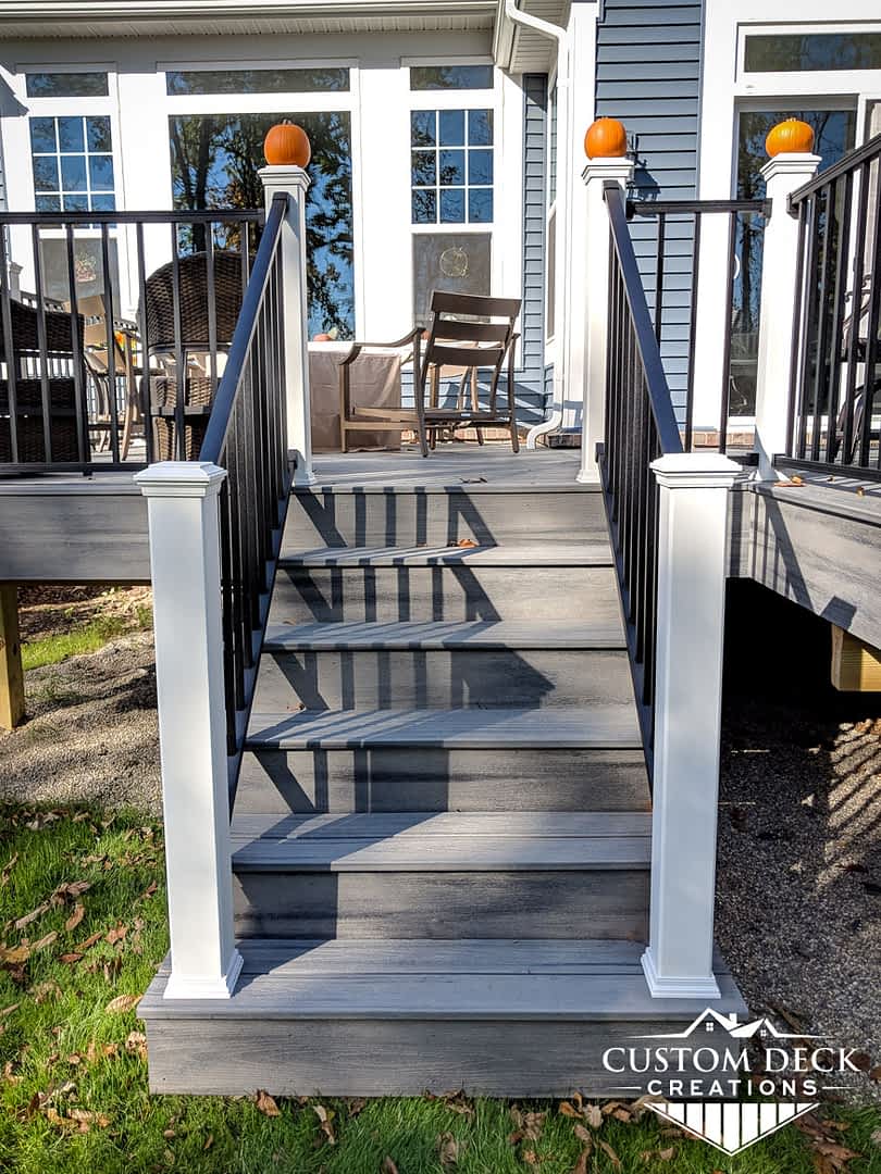 Composite Trex stairs in grey and white built by Custom Deck Creations